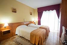 Bedroom in Melide hotel