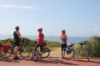 cyclists beside the sea