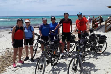 cyclists beside nice beach