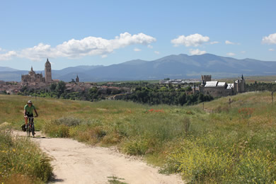 Cyclist with city in the background