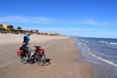two bikes on the beach having reached the med.