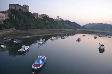fishing boats on high tide near San Vicente de la Barquera