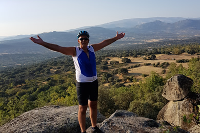 cyclist stands in wide open space