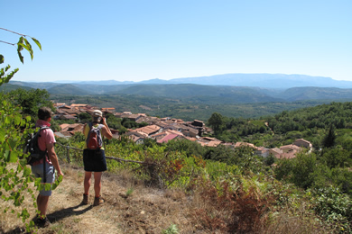 walkers take photo of village