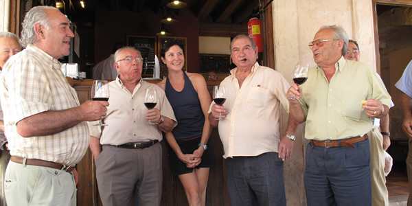 american traveller amongst old spanish men at the bar